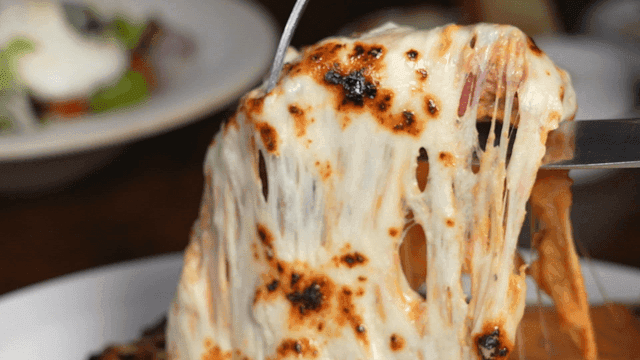 Cheese melting over a steak