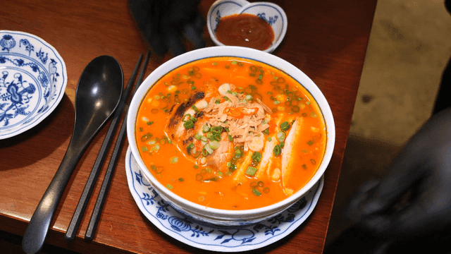 Spicy chicken rice noodles served