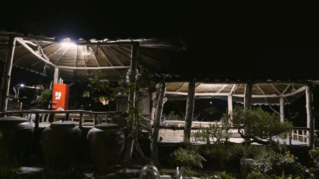 Traditional Korean pavilion on a rainy night