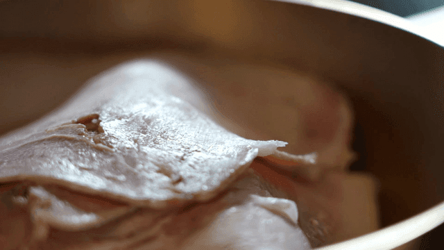 Gomtang meat served on steaming rice in bowl