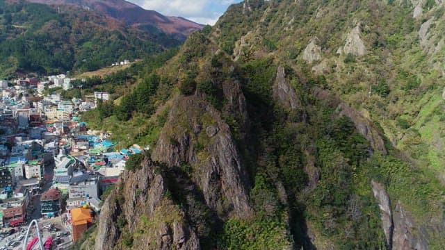 Aerial View of a Town Nestled in Mountainous Landscape