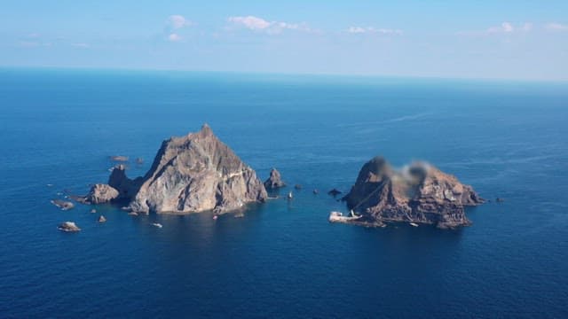 Aerial View of a Rocky Island in the Ocean