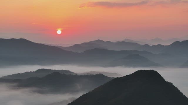 Majestic Sunrise Over Misty Mountains