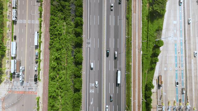 Highway with vehicles and greenery