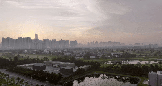 City skyline at dawn with misty atmosphere