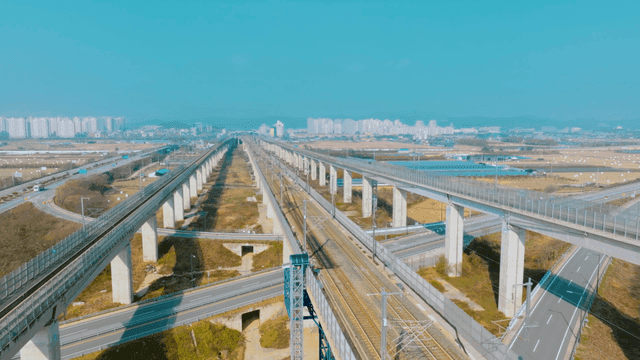 Railway tracks and overpasses in a cityscape