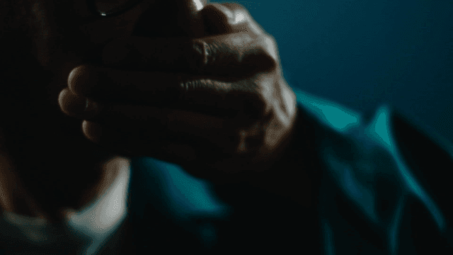 Old man covering his mouth with his hand