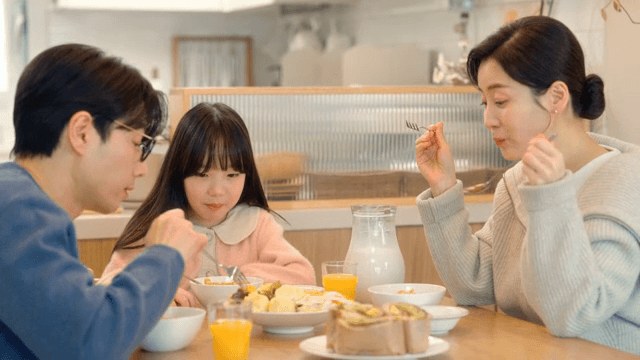 Family enjoying breakfast together