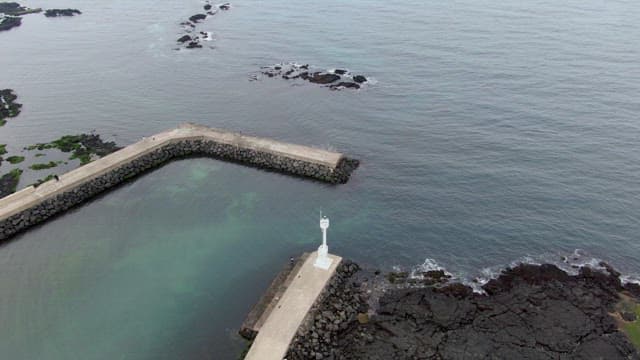 Coastal pier with a lighthouse