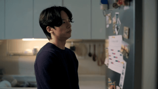 Man putting cake in refrigerator