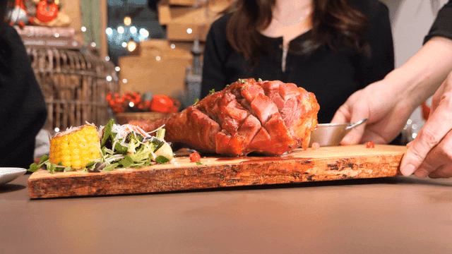 Restaurant meal with roast turkey leg and salad