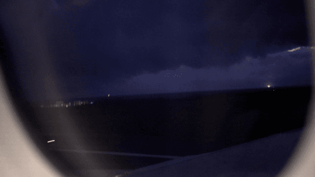 Panic runway night view from airplane window