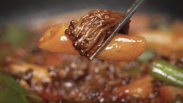 Enoki Mushroom Dish Lifted with Chopsticks