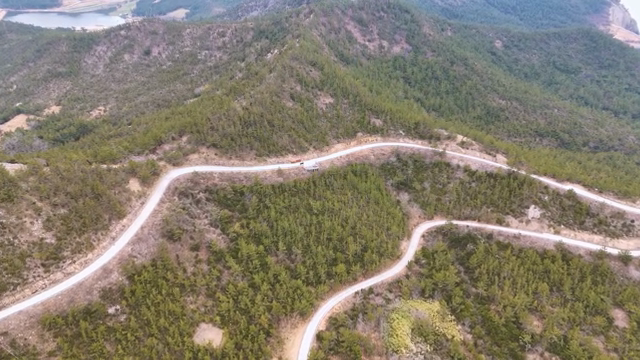 Winding road through lush green mountains