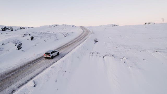 Car driving on a snowy road