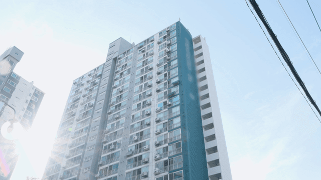 Tall apartment building under clear sky