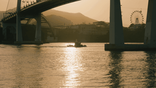 Bridge over sea at sunset