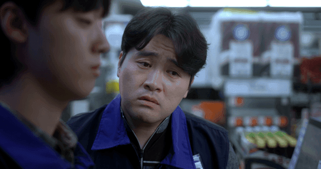 Two men having a conversation in a store