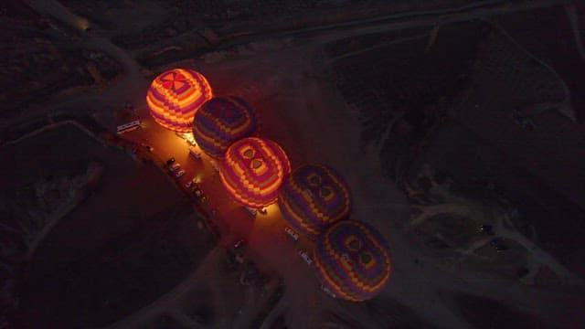 Hot Air Balloons Preparing for Flight at Dawn