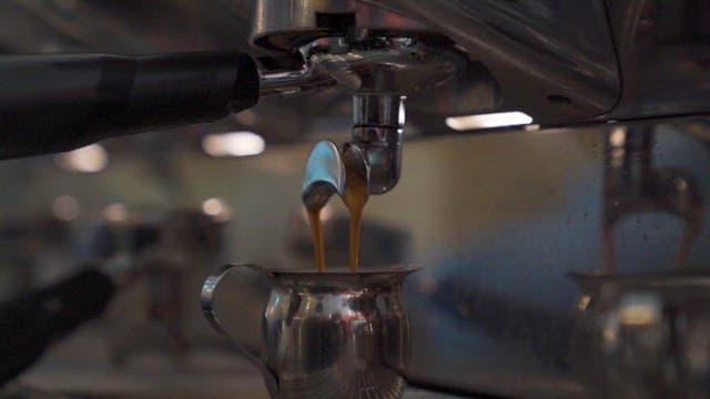 Fresh coffee being brewed in machine