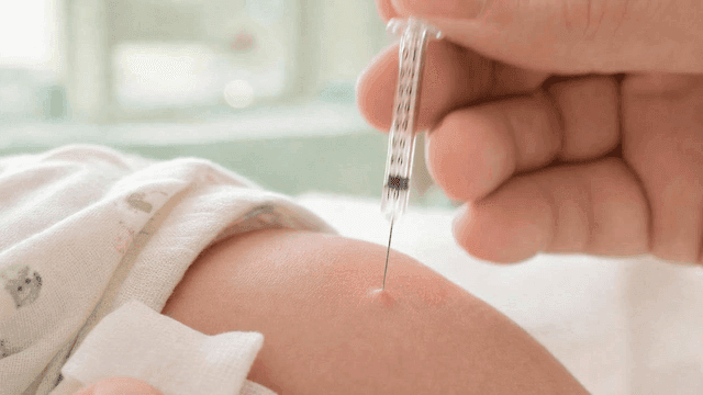 Shot for vaccination in child's arm