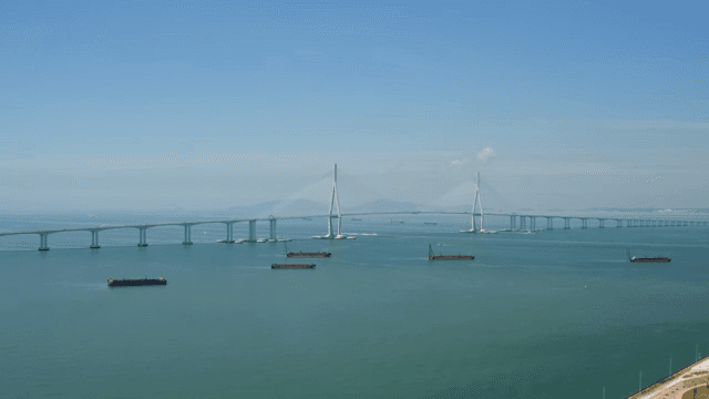 Vast bridge over a calm sea with ships