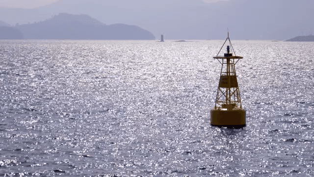 Buoy floating on a shimmering sea