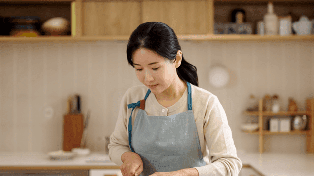 Woman preparing food in a kitchen