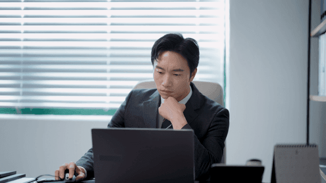 Businessman working at a desk with a laptop