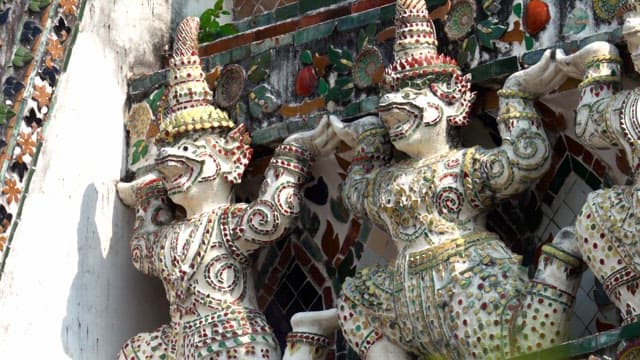 Elaborate sculptures decorate the exterior walls of Thai temple