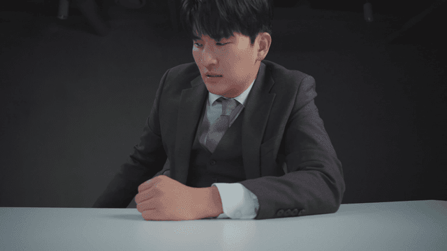 Man sweeping money off the desk