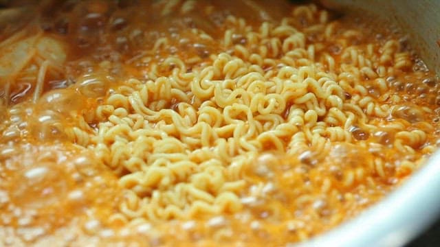 Korean ramen boiling in a pot