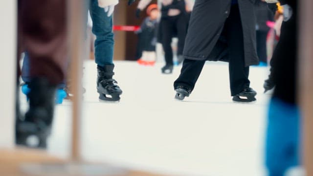 People ice skating at a rink