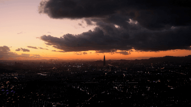 City sunset with dark clouds