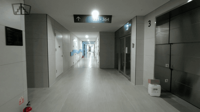Modern hallway with elevators and doors