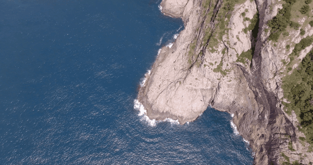Rocky cliffs and blue ocean waves