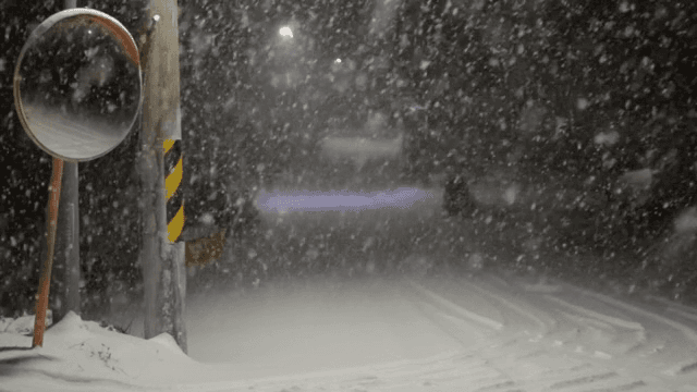 Snowy night at a street corner