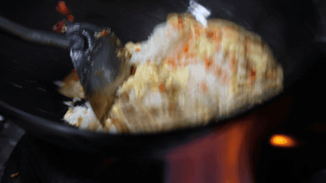 Cooking fried rice in hot wok