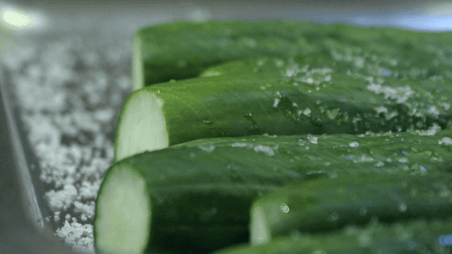 Fresh cucumbers sprinkled with salt