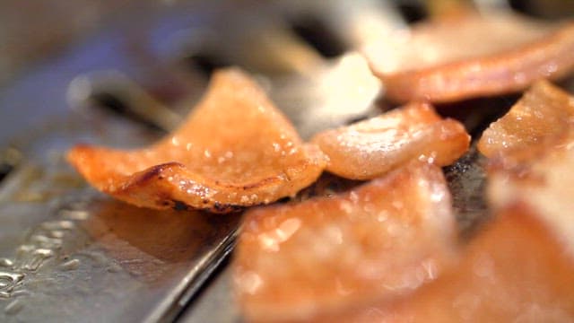 Pork rinds grilled over a grill