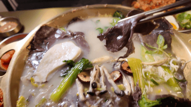 Chopsticks for dipping boiled beef slices in soy sauce for vegetable Hanwoo hot pot