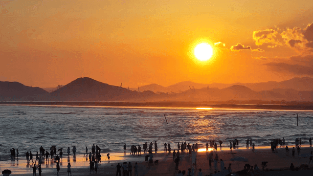 People enjoying a sunset at the beach