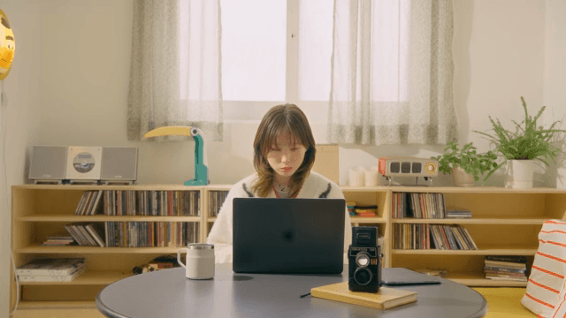 Woman working on a laptop at home