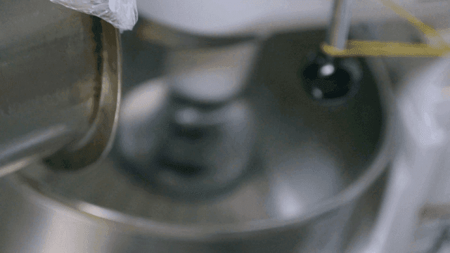 Mixing ingredients in large mixer