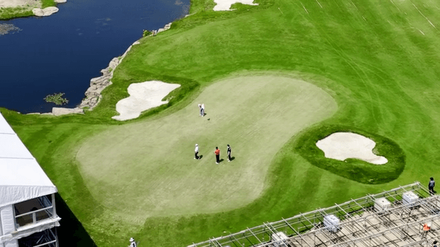 Golfers playing on a green course
