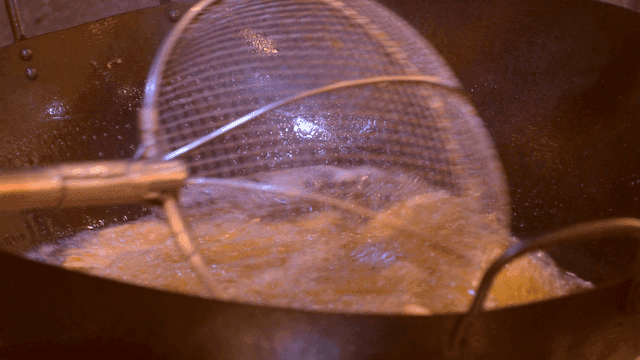 Shrimp fried in large wok