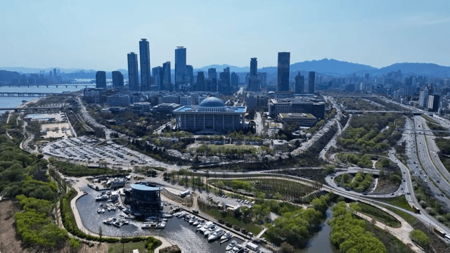 Riverside cityscape with modern buildings and roads