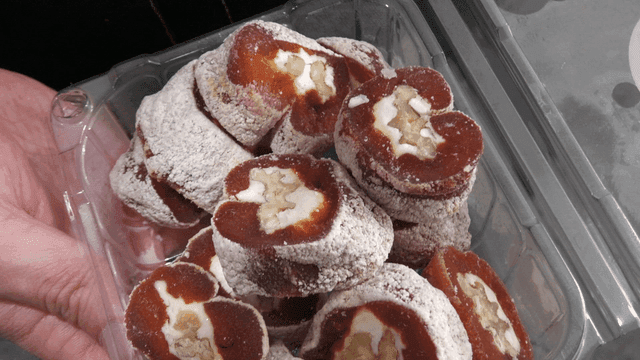 Dried persimmons with walnuts in container