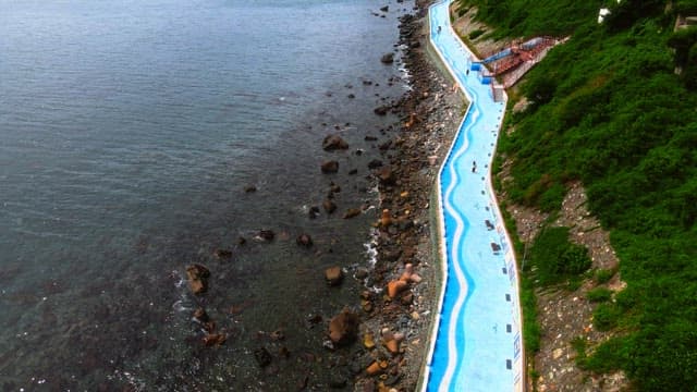 Coastal Walkway Along a Rocky Shoreline