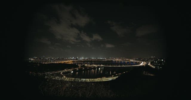 Overlooked View of the River and Riverside Traffic at Night